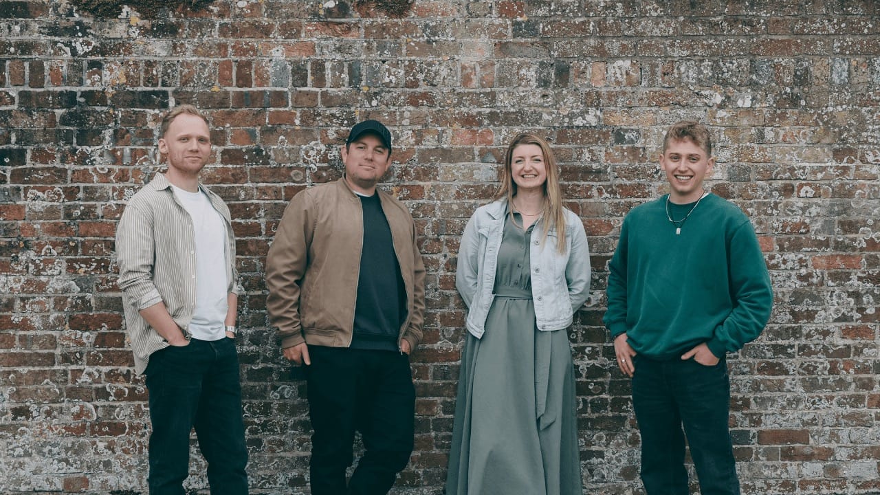 4 members of the Salo team stood in front of a wall.